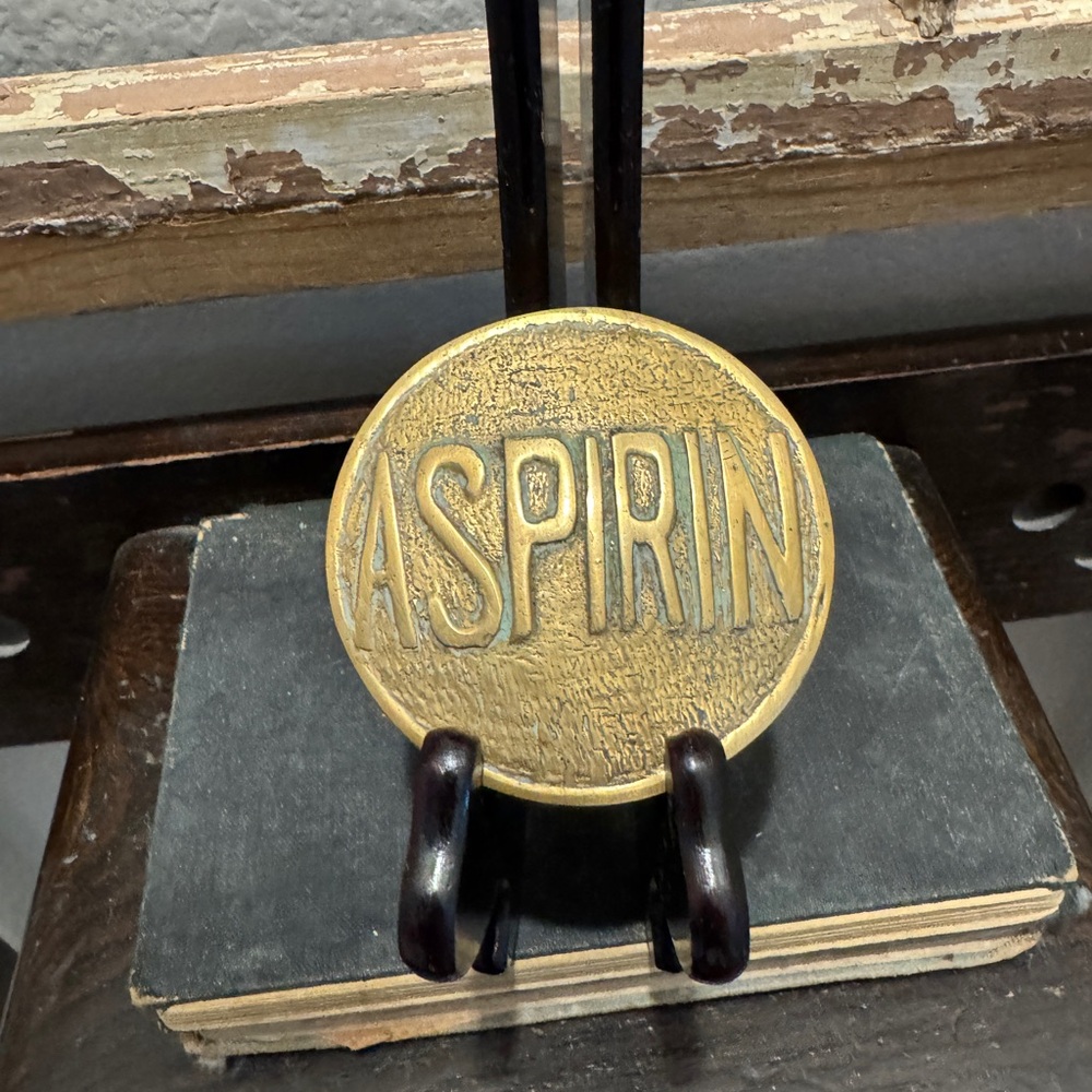 Vintage Brass Aspirin paperweight